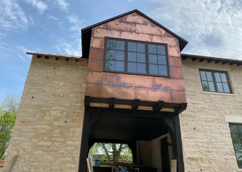 Copper metal panel facade on a stone building for Skylight Installation in Glen Ridge